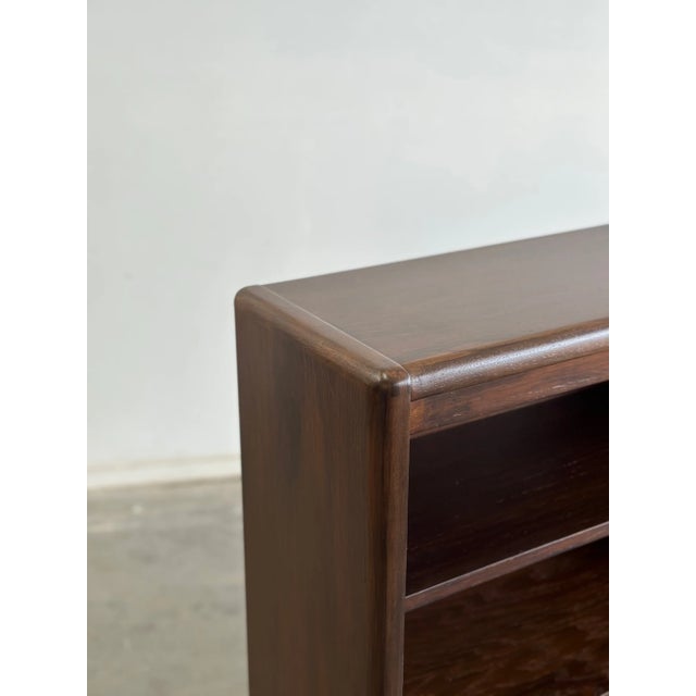 W61 D12 H51 SHELF H9-15 (adjustable) Great thin bookcase with ample shelving. Unit sits on solid cylindrical legs, and...