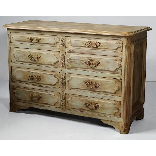 A unique piece! This chest of drawers has been patinated on an antique, solid cherrywood Louis XV style cabinetmaker's...