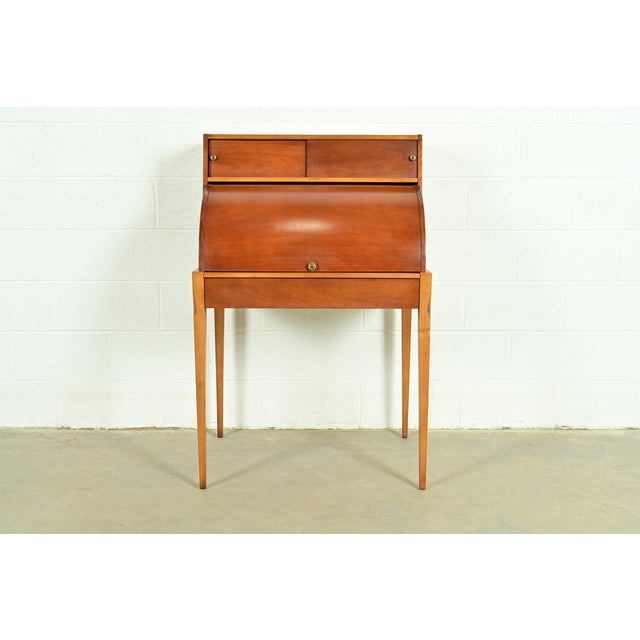 An exceptional Mid-Century Modern roll top writing desk By John Van Koert for Drexel USA, 1959 Sculpted cherry wood, with...