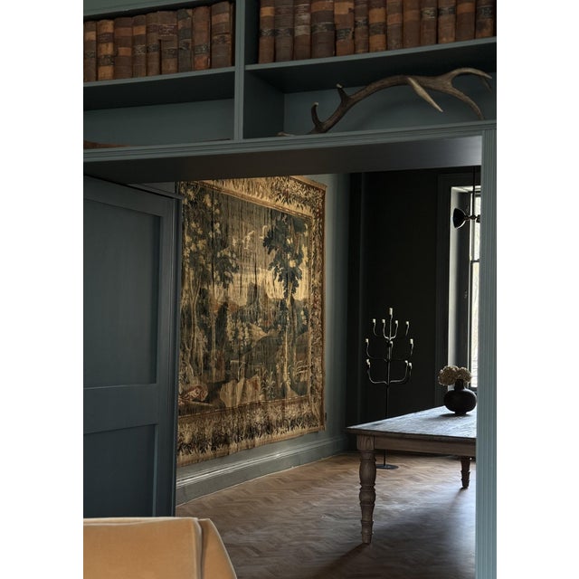 A remarkable 17th century tapestry of exceptional scale, this piece stands as a rare survivor of great weaving traditions....