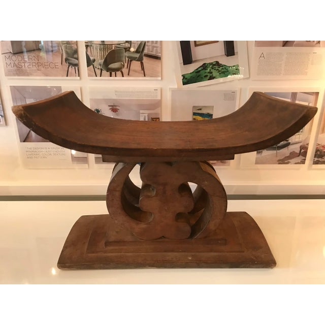 Beautiful hand carved wood stool or bench made by the Ashanti People of Ghana, West Africa. It's carved from one piece of...