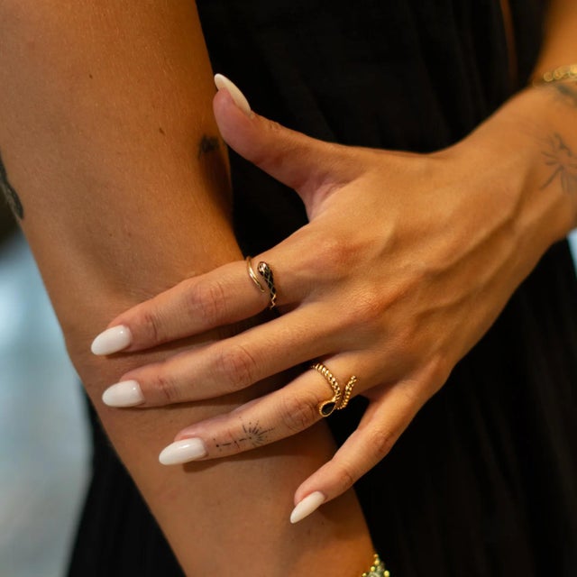 Elegant and mysterious, the Midnight Teardrop Black Onyx Gold Adjustable Ring features a slim bronze band plated with 18K...