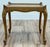 Vintage French Provincial style burled wood table featuring curved legs and frame with X cross detail to tabletop....