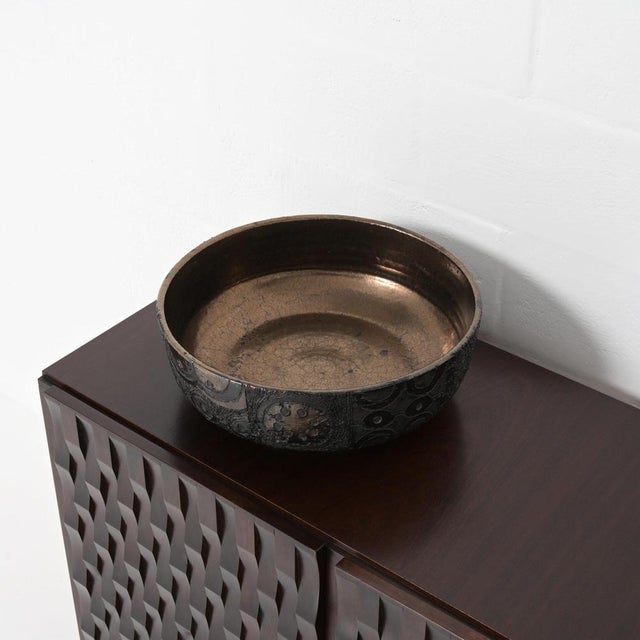 This large ceramic bowl was made in the studio of Perignem. It can be dated in the 1960s. The decoration is typicaly for...