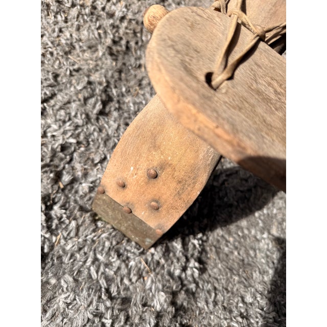 This is a very old camel saddle in rustic condition. Normally, it would have a cushion, which can easily be added.