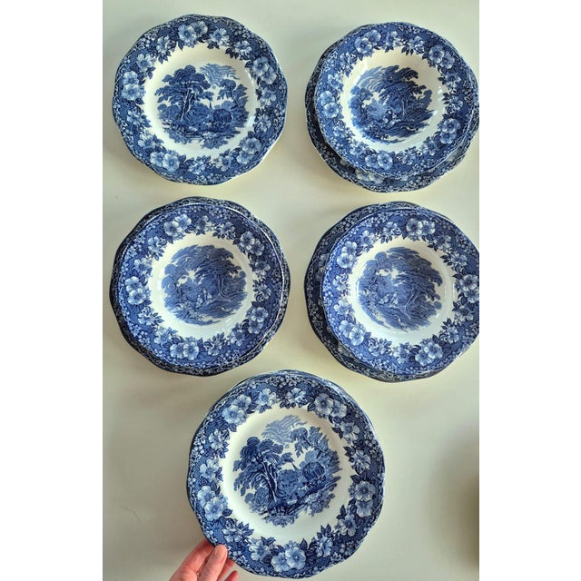 A stunning dinnerware set for six in fine Ironstone (strong earthenware), decorated with the iconic "English Scene" motif...