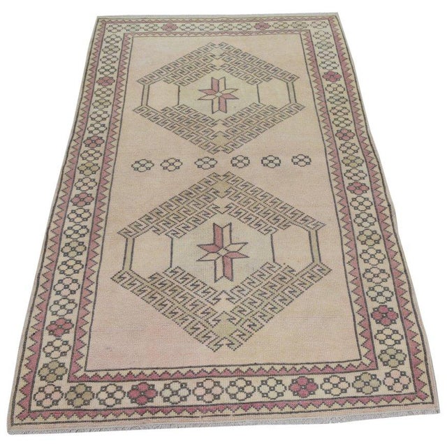 Hand-knotted with care using traditional rug-making techniques, this wool rug blends timeless craftsmanship with a modern...