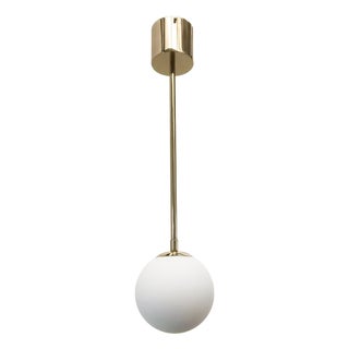Uno Polished Brass Matte White Globe Pendant by Fabio LTD For Sale