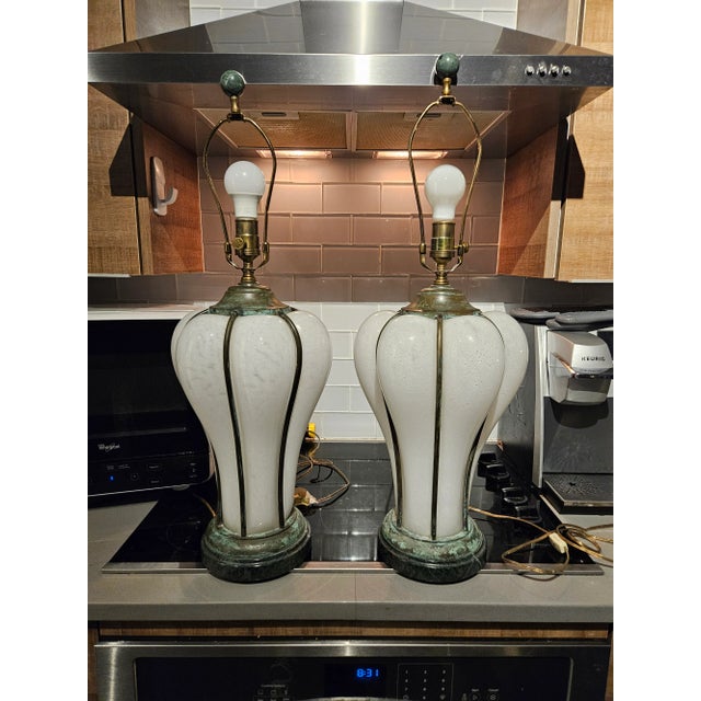 Incredible Statuesque Sarreid Italian Bronze Caged Murano White Glass Lamps hand blown without damage in working condition.