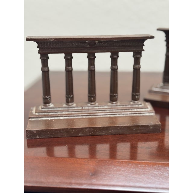 Add a touch of classical refinement to your library or office with this handsome pair of antique Bradley & Hubbard...