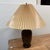 Design Plus Gallery presents an antique Japanese table lamp. A stunning bronze vase, dating to the Meiji period, has been...