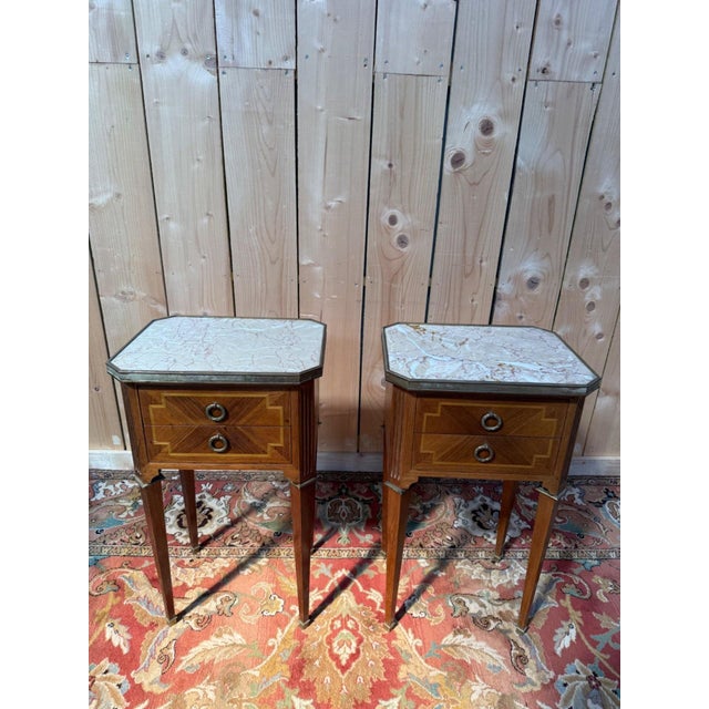 Pair of Louis XVI style bedside tables, signed Gouffé Paris, made in the 1950s-1960s. The rectangular bodies with canted...