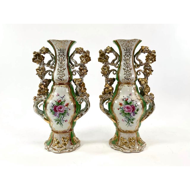 Richly decorated and exceptionally elegant, this monumental pair of 19th-century Old Paris porcelain mantel vases embodies...