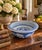 A classic large Chinoiserie blue and white porcelain bowl with painted koi fish which are balanced with a crisp border...