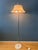 Very rare space age floor lamp featuring a large white acrylic glass shade with a sleek futuristic design. The acrylic...