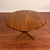 Vintage Danish modern solid teak dining table with split pedestal base. It seats four comfortably round and six with the...