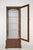 Vintage Traditional style curio display cabinet with a dark stained wood frame, a mirrored back, four adjustable glass...