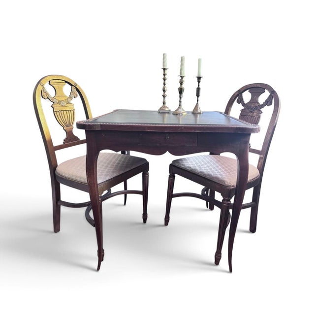 18th century Louis XV style game table with leather nail head trim top. Estimated to be made in the 1930s and is marked...