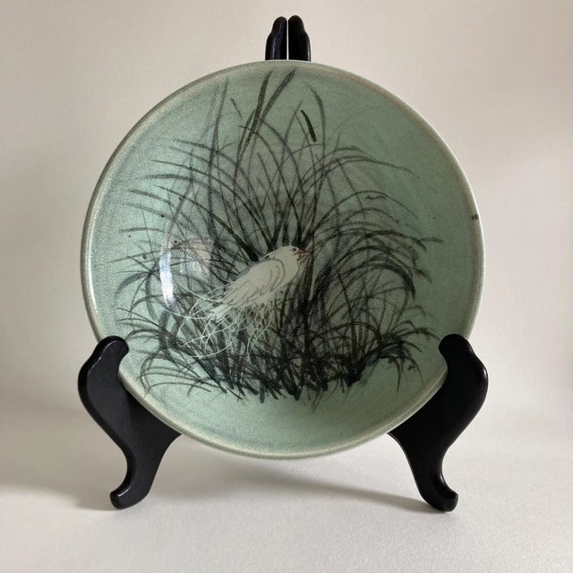 A beautiful, solid piece of coastal themed studio pottery. This handmade pottery bowl features a heron marsh scene on a...