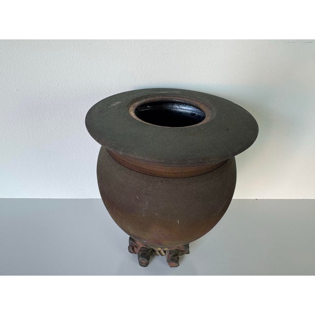 A striking 1980s vintage studio pottery vase showcasing the unique artistry of Raku ceramic technique. This handcrafted...