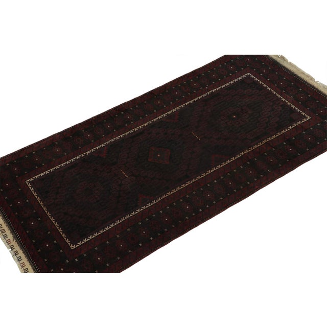 Hand knotted in wool, this 3x6 Baluch rug represents a new line of tribal carpets in the Modern Classics Collection by Rug...