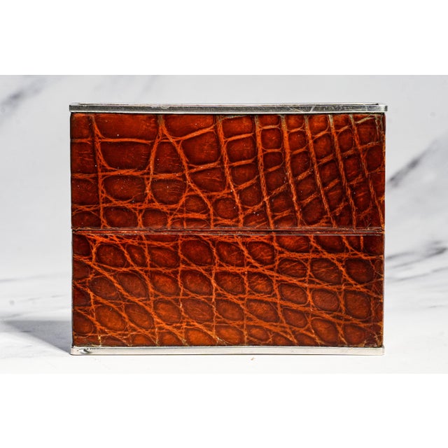 A sophisticated example of early twentieth-century luxury craftsmanship, this elegant 1920s antique call card case...