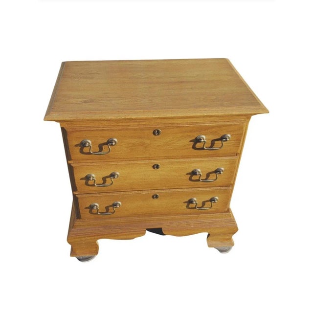 Kincaid Chippendale Oak Bedside Chest or Nightstand. Measures 24" in width, 16" in depth and stands 23" tall.