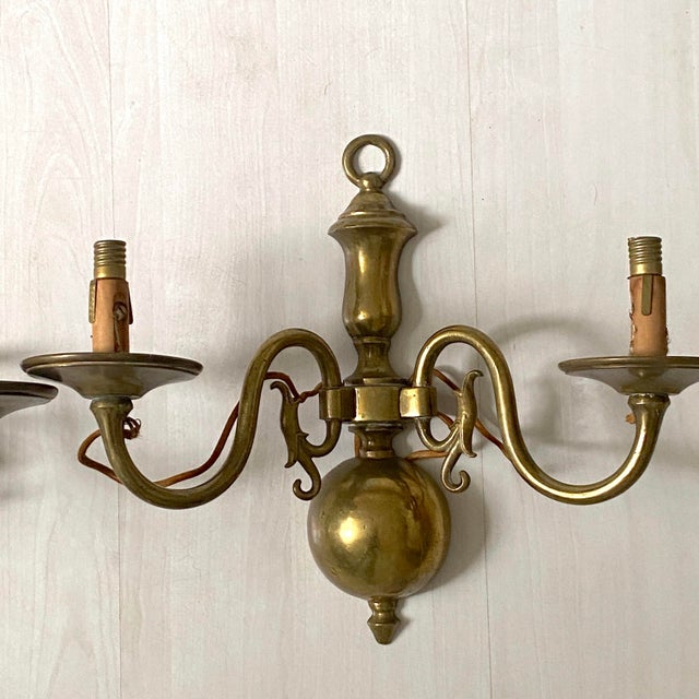 Pair of Dutch brass wall sconces for E14 bulbs (small screw) Height: 27 cm Width: 32.5 cm Depth: 14 cm Weight: 1 kg...