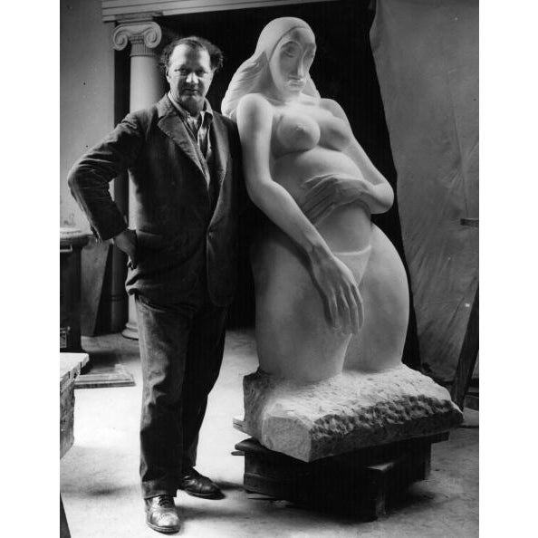 Genesis American-born British sculptor Jacob Epstein (1880 - 1959) with his sculpture 'Genesis'. (Photo by Fox...