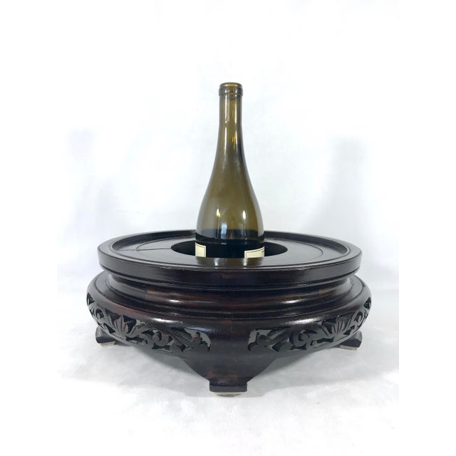 Very large vintage Chinese rosewood stand, hand carved in great detail around the edges with a raised turned top for the...