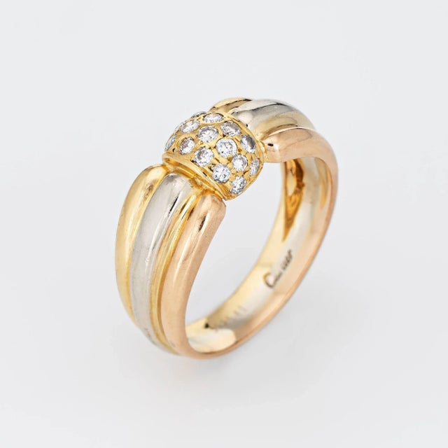 Vintage Cartier diamond ring crafted in 18 karat yellow, rose & white gold (circa 1980s to 1990s). 17 round brilliant cut...