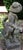 Mid-20th century English cast stone garden fountain statue of a boy. He is piped through his leg to the jug he holds in...