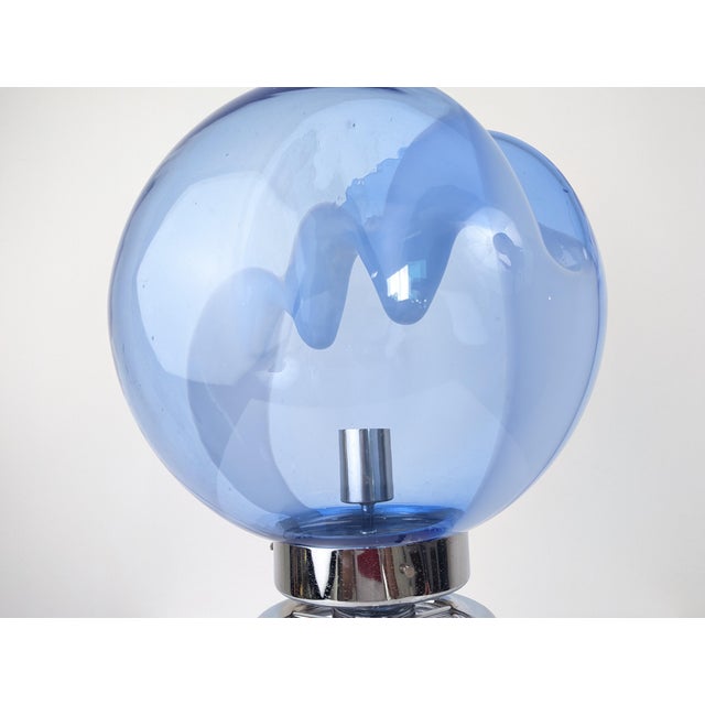 A 1970s Toni Zuccheri-designed table lamp featuring blown blue glass, showcasing the experimental nature of Italian...