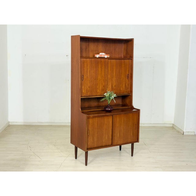 Beautiful vintage secretary desk in classic Danish mid-century design. Crafted from high-quality teak, this piece...
