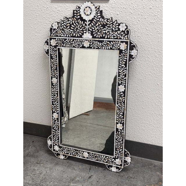 Design Plus Gallery presents a Moroccan Style Mother-of-Pearl Inlaid Floral Wall Mirror. This decorative wall mirror has a...
