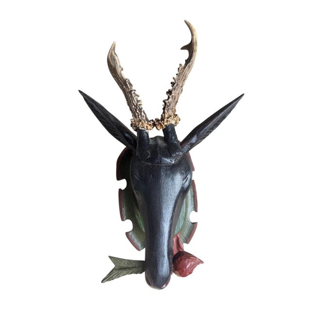 A Black Forest hand-carved deer head with antlers from Germany — classic alpine trophy carving. Measures 9"W x 4.97"D x...
