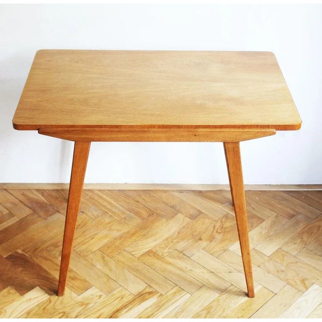This Mid Century Modern coffee table is made of solid Ash, and has a beautiful grain and elegant tapering table legs. The...