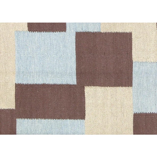 Contemporary Egyptian Kilim Rug. Hand woven in modern designs with wool on cotton foundation in the Fustat region of the...