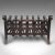 This is a vintage fire basket. An English, wrought iron fireplace in Gothic revival taste, dating to the mid 20th century,...