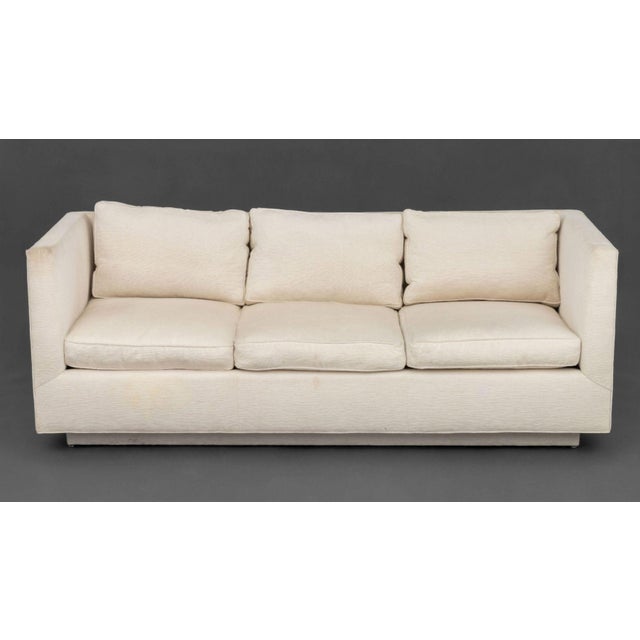 Modern White Upholstered Three-seat Sofa. 29" H x 79" W x 33" D; seat: 18" H. Provenance: From a 45 Sutton Place South...