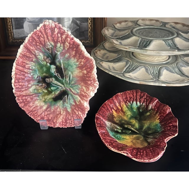 19th century majolica leaf plates, set of two in varying shades of pink and red made in the United States or England. Pink...