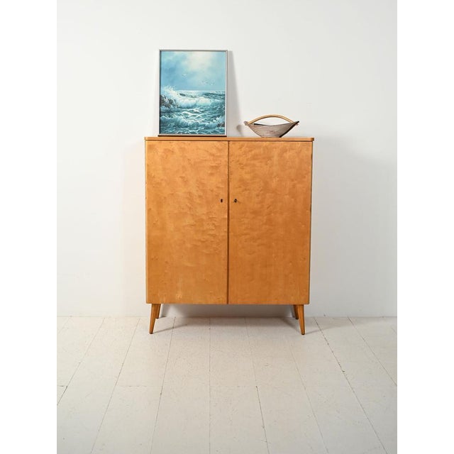 Scandinavian 1950s birch cabinet, featuring bright grain and interiors with natural wood drawers and shelves. Scandinavian...