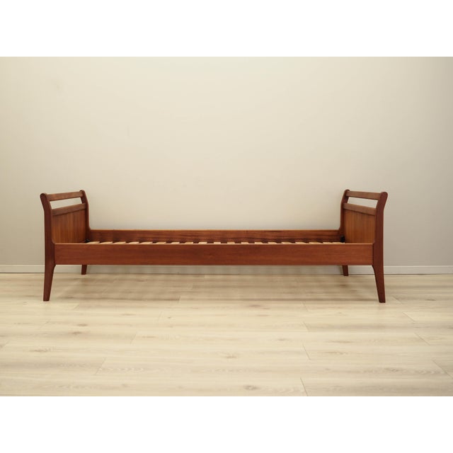 The bed was made in the 1970s, Danish production. The structure is covered with teak veneer. The legs are made of solid...