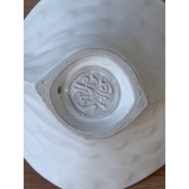 A sculptural ceramic bowl by Jonathan Adler, from his Menagerie-era pottery line. The small size of his bestselling Bird...