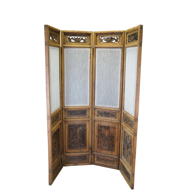 Antique Chinese Chinoiserie four panel room divider or dressing screen. Made of Elm featuring inset silk screen,...