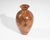 A wooden vase by New Zealand artisan Jim Robbie. Vase is made from Tawhai Burr wood. Signed to the bottom edge and marked...