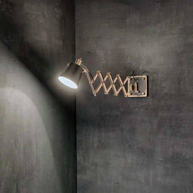 Pastorius wall lamp has an industrial chic style and features swing arms that are an American classic. Sophisticated and...