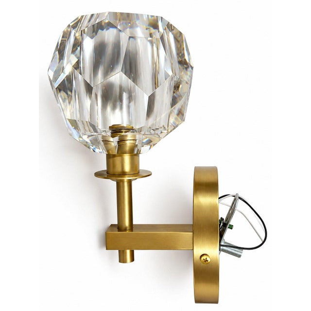 These Zeev Lighting elegant wall sconces have a beautiful balance of simplicity and luxury. The clear faceted crystal...