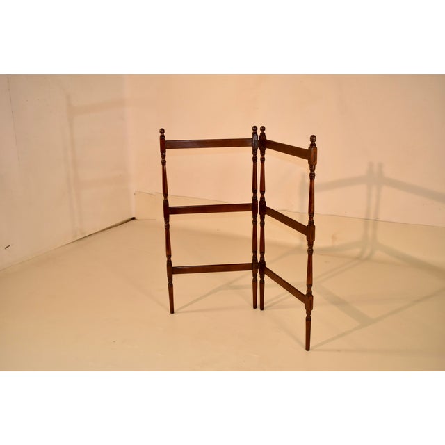 Early 19th century walnut blanket or quilt rack from England. The tops of each of the legs are decorated with hand turned...