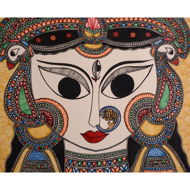 Celebrate the rich artistic heritage of Mithila, India, with this exquisite hand-painted Madhubani artwork by Mamta Devi,...